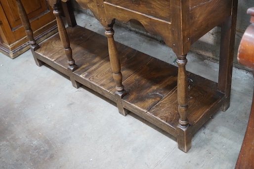 An 18th century style elm pot board dresser with boarded rack, length 132cm, depth 39cm, height 187cm